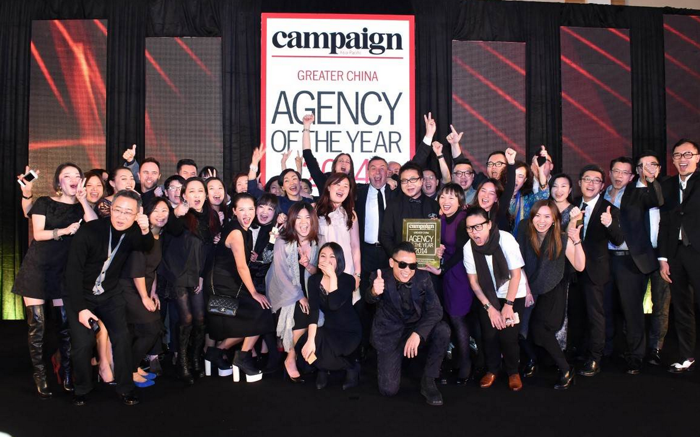 Alexis (centre right, holding the award) and his team go all-in at work and at play. This has enabled them to create many extraordinary results.